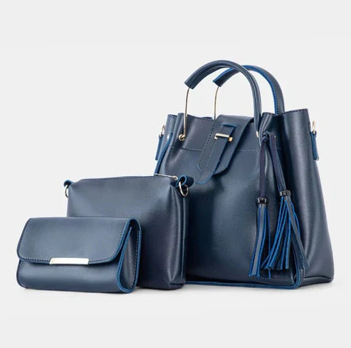 Women's handbag bundle featuring a structured tote, crossbody bag, and coordinating wallet in navy blue.